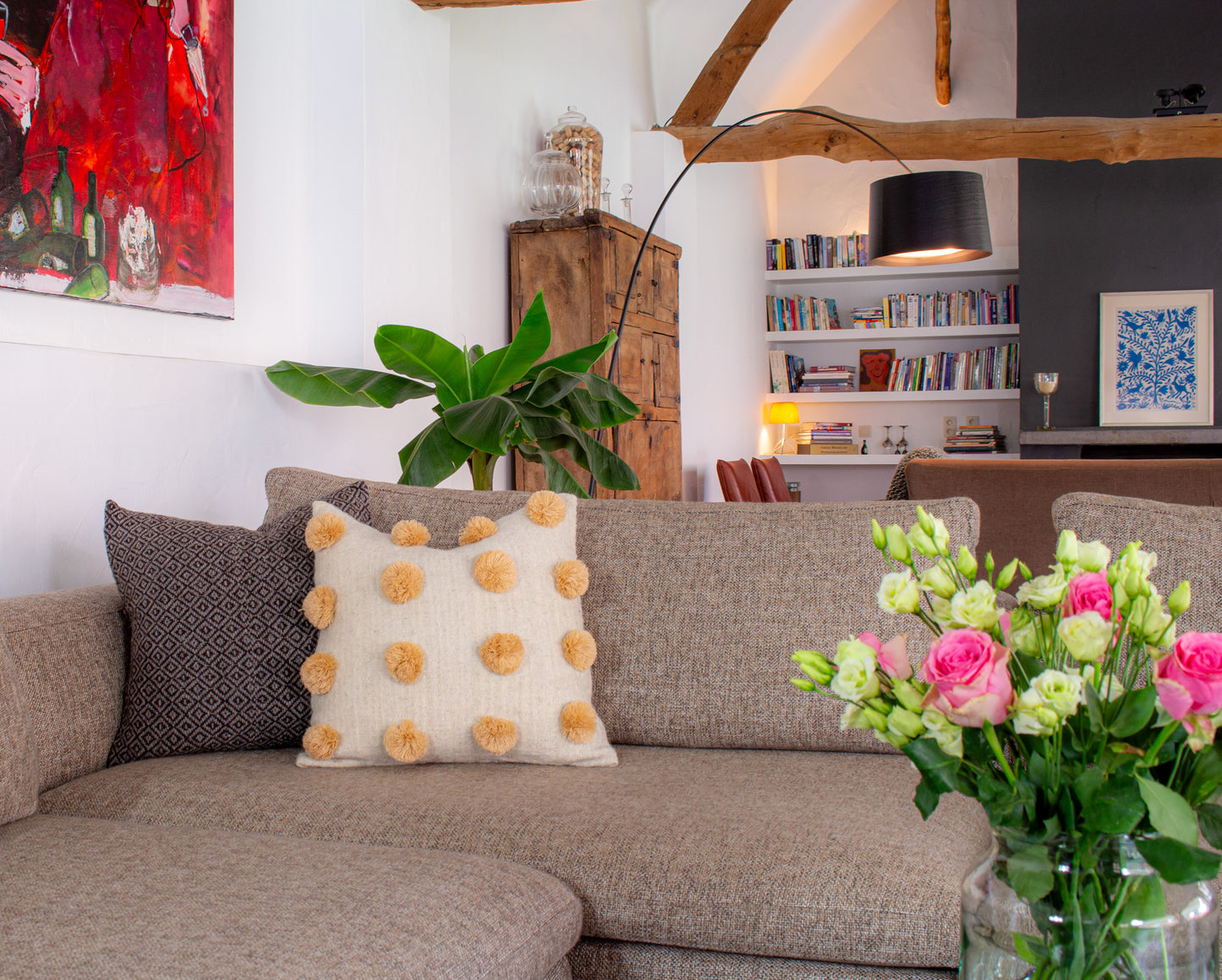 Stylish Beige Wool Cushion with Delightful Pom Poms, Elevating Living Room Decor