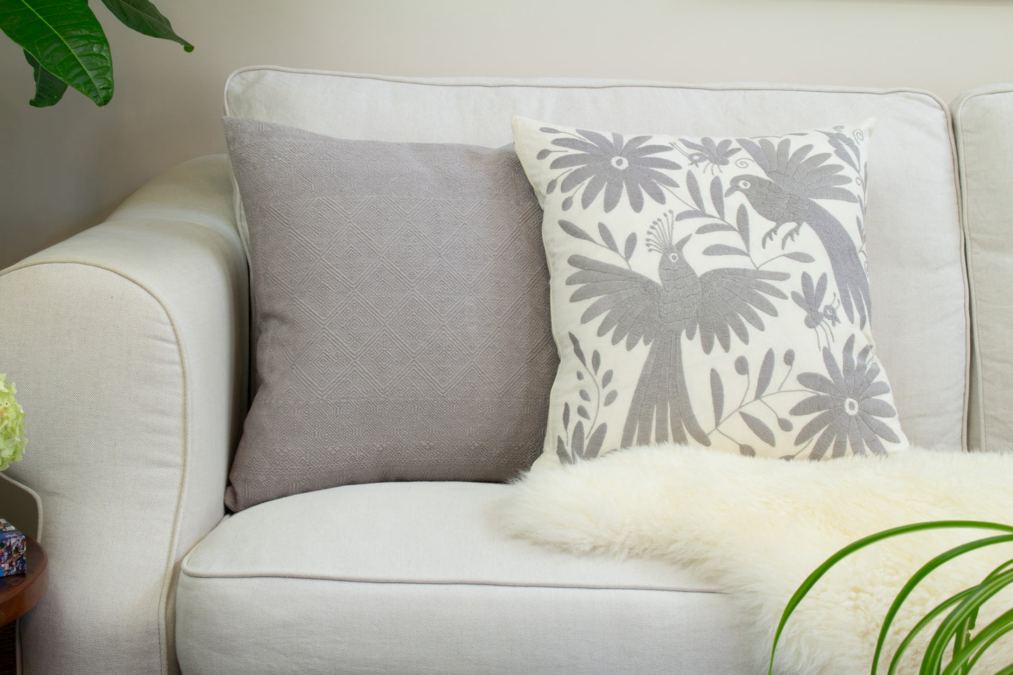 Grey Handcrafted Tenango Otomi Embroidery Cushion with Animal and Flower Designs, elevating living room decor.