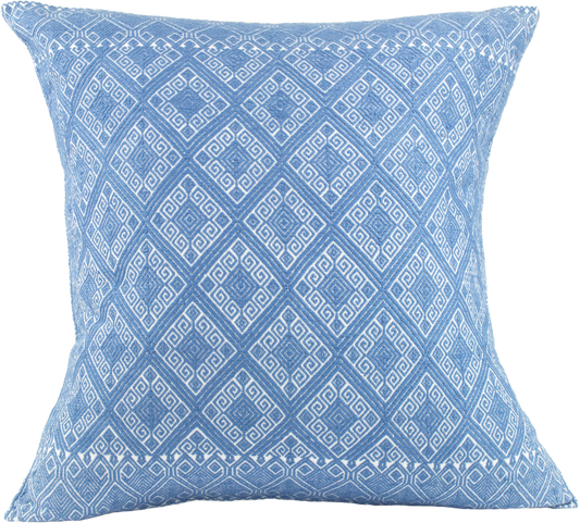 Victoria Chiapas Cushion - A white cotton cushion with a blue diamond pattern woven on a backstrap loom, featuring a stylish folding closure at the back.