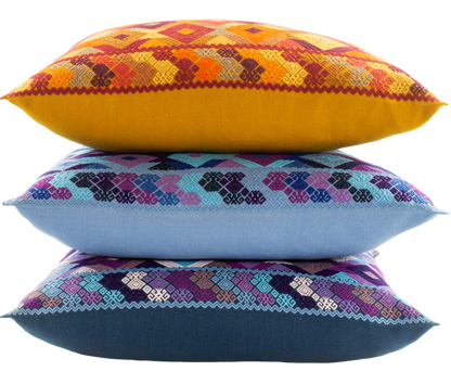 Juanas Chiapas Cushions Collection with intricate diamond shapes in vibrant colors.