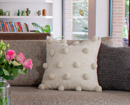 Stylish Beige Wool Cushion with Delightful Pom Poms, Elevating Living Room Decor