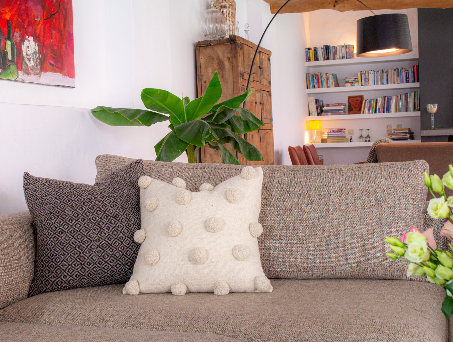 Stylish Beige Wool Cushion with Delightful Pom Poms, Elevating Living Room Decor