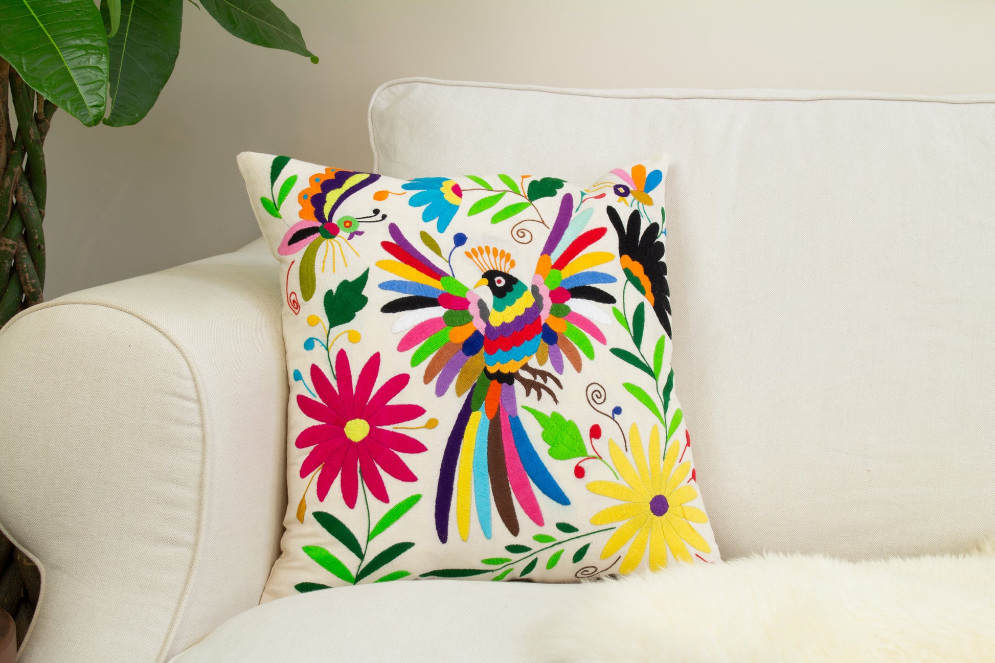 Handcrafted Tenango Otomi Embroidery Cushion with Animal and Flower Designs, elevating living room decor.