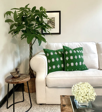 Green cotton cushion with intricate beige brocade designs, elevating living room decor.