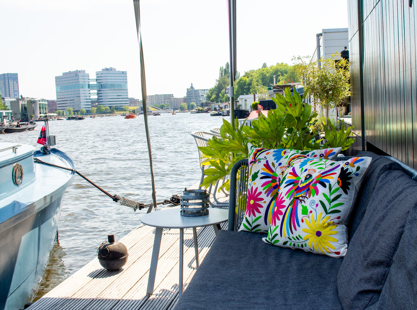 Vibrant Otomi Embroidery Cushion Adds Color to a Cozy Terrace Setting