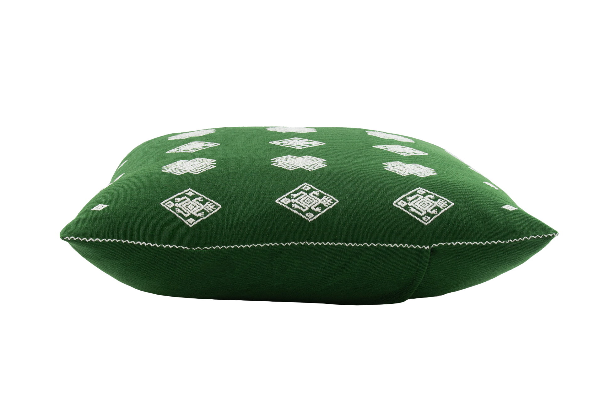 Green cotton cushion with intricate beige brocade designs, showcasing traditional backstrap loom weaving