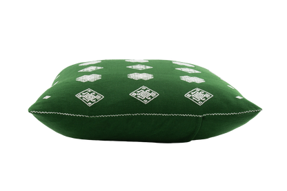 Green cotton cushion with intricate beige brocade designs, showcasing traditional backstrap loom weaving