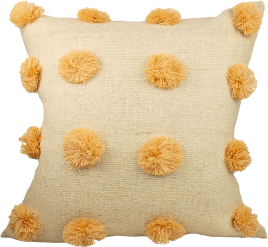 Beige Cushion crafted from 100% wool, adorned with charming pink pom poms and featuring a secure folding back with cute delicate ribbons closure.