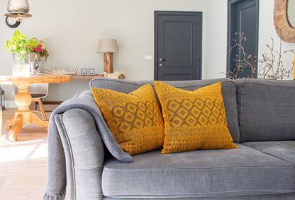 Black Metallic Thread Diamond Brocade Chiapas Cushion, featuring a cotton base in a deep shade of yellow elevating living room decor