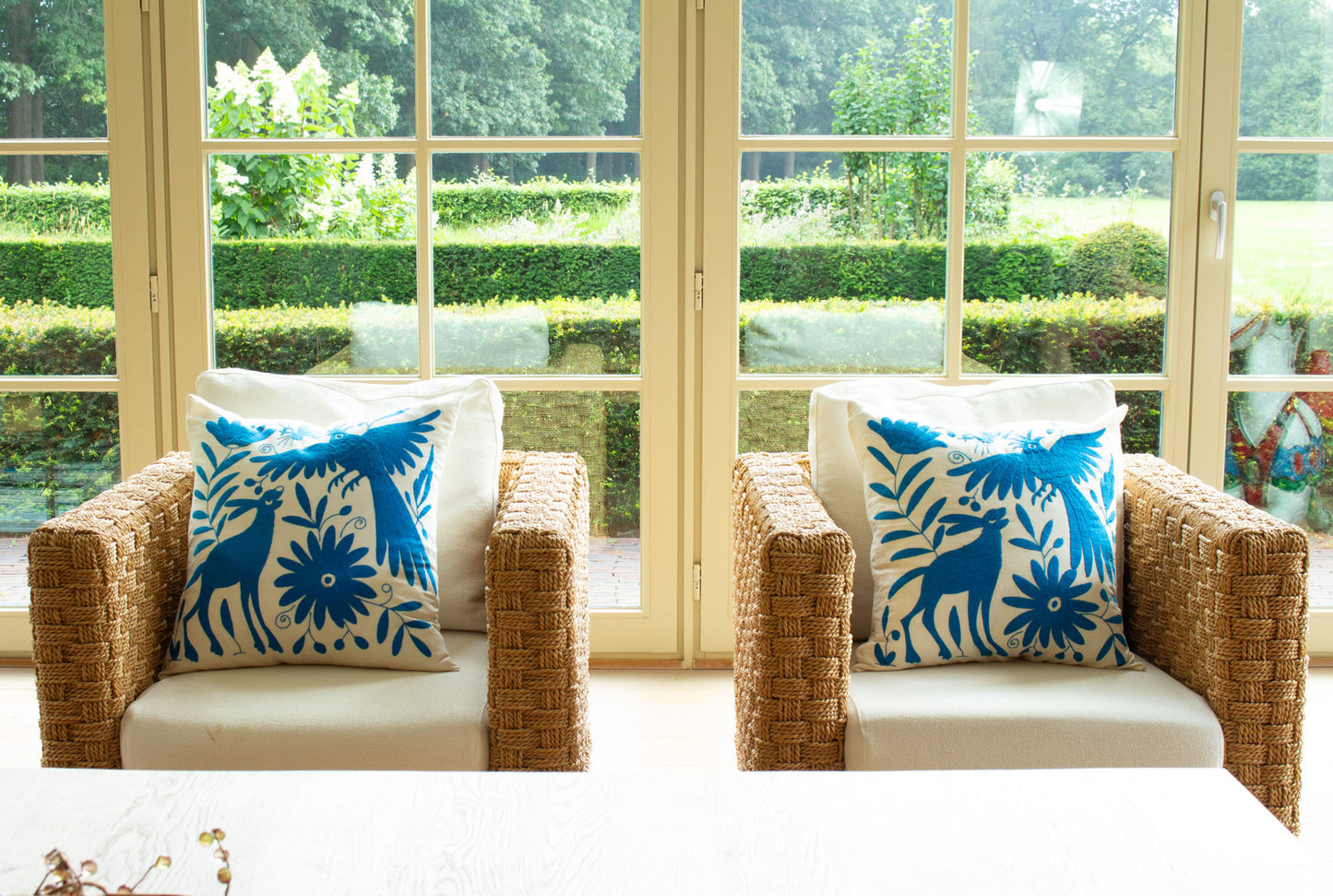 Blue Handcrafted Tenango Otomi Embroidery Cushion with Animal and Flower Designs, elevating living room decor.