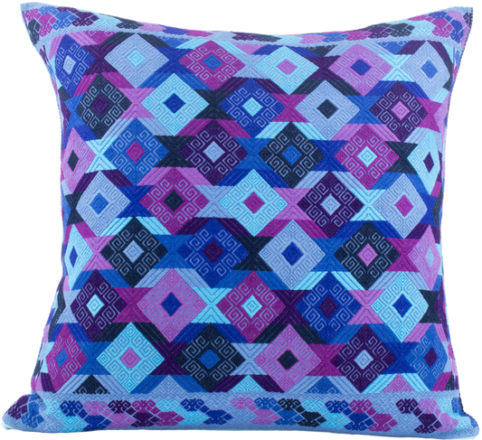 Light blue Chiapas cushion with intricate diamond shapes in vibrant colors, showcasing artisanal craftsmanship